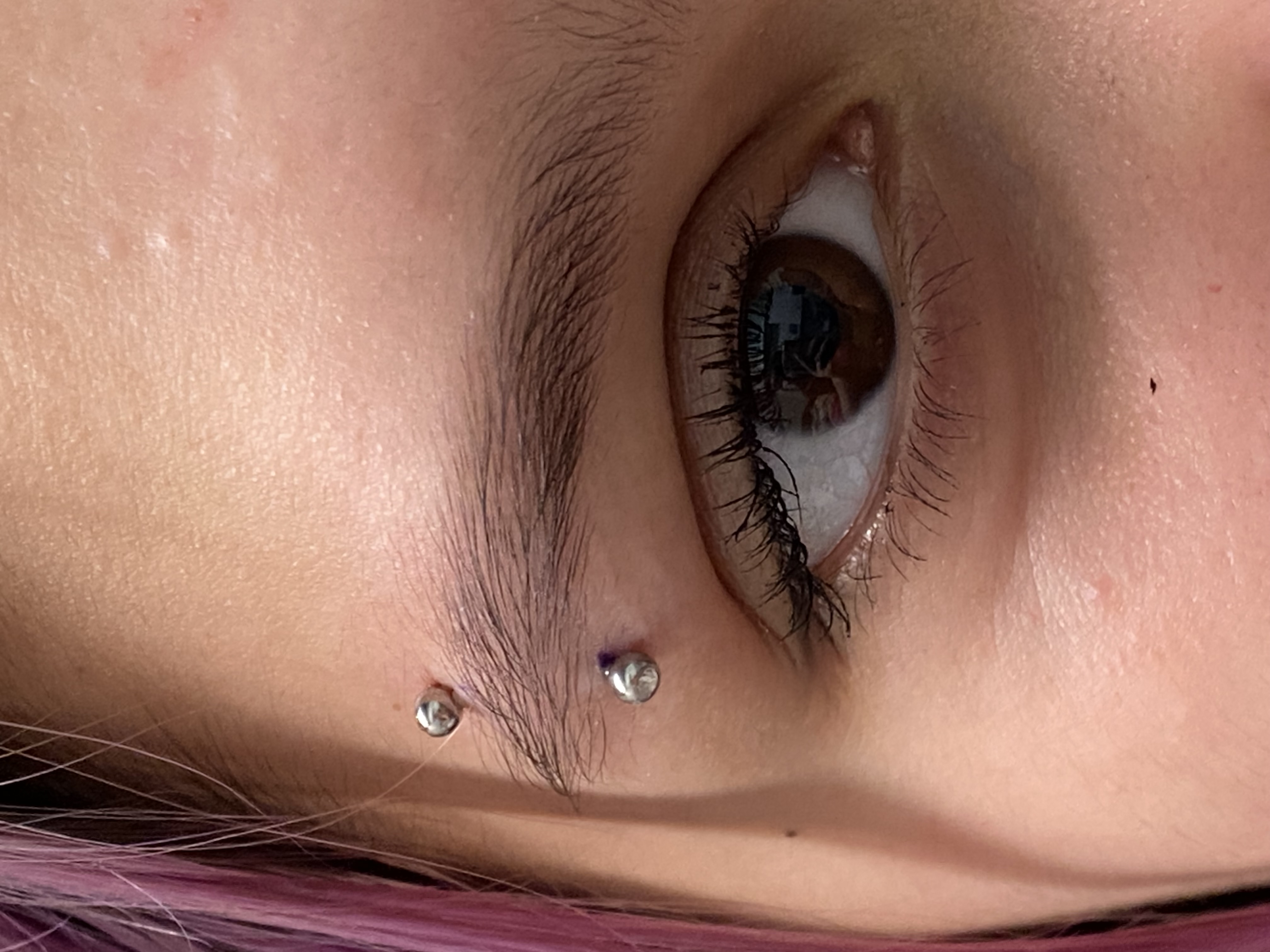 Eyebrow piercing.